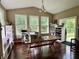 Bright hobby room features hardwood floors, shelving for storage, and a large table for crafting at 1518 Valdarno Dr, Greenwood, IN 46143