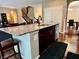 Well-designed kitchen island with dark cabinets, granite countertops, and stainless steel appliances at 1518 Valdarno Dr, Greenwood, IN 46143