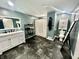 Modern bathroom with a stand alone vanity, tiled floors, a shower, and an accent mirror at 1579 Crest Dr, Shelbyville, IN 46176