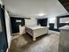 Cozy bedroom with carpet floors, a queen bed, and modern décor at 1579 Crest Dr, Shelbyville, IN 46176