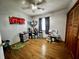 Bedroom with wood floors, ceiling fan and an organized shelving unit at 1579 Crest Dr, Shelbyville, IN 46176