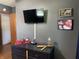 Bedroom features black dresser, mounted tv and décor at 1579 Crest Dr, Shelbyville, IN 46176