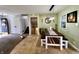 Open dining room featuring a long wooden table and bench seating, and modern decor at 1579 Crest Dr, Shelbyville, IN 46176
