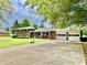 Lovely brick home with long driveway and attached two-car garage, perfect for families at 1579 Crest Dr, Shelbyville, IN 46176
