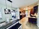 Open kitchen with wood cabinets, stainless appliances, tile floor and a center island at 1579 Crest Dr, Shelbyville, IN 46176
