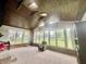 Sunroom with many windows, vaulted wood ceiling, furniture and carpet at 1579 Crest Dr, Shelbyville, IN 46176