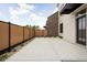A rear exterior featuring a concrete patio and a wood fence at 1675 Solebar Way, Westfield, IN 46074