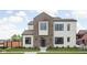 Beautiful home featuring a mixed material facade of siding and brick, green lawn and professionally landscaped flower beds at 1675 Solebar Way, Westfield, IN 46074