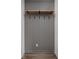 Mudroom featuring a gray paneled accent wall, shelf and coat hooks at 1675 Solebar Way, Westfield, IN 46074