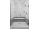 Modern walk-in shower featuring gray subway tile accent and bench seat at 1675 Solebar Way, Westfield, IN 46074