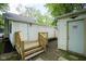 Back yard features a small deck and separate shed for tenant storage at 2012 George St, Anderson, IN 46016
