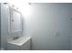 Clean, simple bathroom with a modern vanity and mirror, featuring a fresh aesthetic at 2012 George St, Anderson, IN 46016