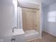 Bright bathroom with tile shower, modern vanity, and updated fixtures at 2012 George St, Anderson, IN 46016