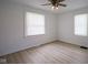 Cozy bedroom with two windows providing natural light, neutral paint and laminate flooring at 2012 George St, Anderson, IN 46016