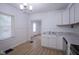Well-lit kitchen boasts stainless appliances, white cabinets, and an open layout at 2012 George St, Anderson, IN 46016