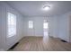 Spacious living room with wood floors, light blue paint and lots of natural light at 2012 George St, Anderson, IN 46016