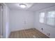 Mud room with windows providing natural light, neutral paint, and durable laminate flooring at 2012 George St, Anderson, IN 46016