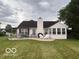 View of the backyard patio with a pergola, a sunroom, and a seating area at 2018 Alysheba Dr, Indianapolis, IN 46234