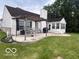 Spacious backyard patio with a pergola, an outdoor dining set, and seating at 2018 Alysheba Dr, Indianapolis, IN 46234
