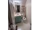 Cozy bathroom featuring a vanity with storage, a toilet, and modern shelving at 2018 Alysheba Dr, Indianapolis, IN 46234