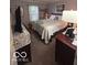 The bedroom has neutral walls with a queen bed, a dresser, and night stand at 2018 Alysheba Dr, Indianapolis, IN 46234