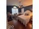 This bedroom features a ceiling fan, and a window allowing for natural light at 2018 Alysheba Dr, Indianapolis, IN 46234