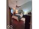 Spacious bedroom with hardwood floors, and a ceiling fan at 2018 Alysheba Dr, Indianapolis, IN 46234