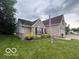 Beautiful home with brick and vinyl siding, and a well manicured yard and landscaping at 2018 Alysheba Dr, Indianapolis, IN 46234
