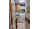 This laundry room features a front loading washer and dryer and cabinet storage at 2018 Alysheba Dr, Indianapolis, IN 46234