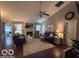 Cozy living room with hardwood floors, fireplace, and comfortable leather furniture at 2018 Alysheba Dr, Indianapolis, IN 46234
