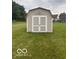 Outdoor storage shed in a backyard setting with a grassy lawn at 2018 Alysheba Dr, Indianapolis, IN 46234