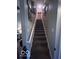 Carpeted staircase with white handrail leads to the upper level of the home at 2018 Alysheba Dr, Indianapolis, IN 46234
