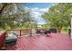 A lovely backyard and wooden deck with a view of the lake at 2114 Turning Leaf Dr, Franklin, IN 46131
