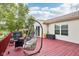 Backyard with a red stained wood deck and comfortable egg chair at 2114 Turning Leaf Dr, Franklin, IN 46131