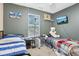 This bedroom has two beds, a window, and gray walls at 2114 Turning Leaf Dr, Franklin, IN 46131