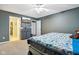 This is a bedroom with carpet, gray walls, and a flat-screen television on the wall at 2114 Turning Leaf Dr, Franklin, IN 46131