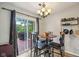 Cozy dining area with a round table and chairs, adjacent to sliding doors opening to a deck at 2114 Turning Leaf Dr, Franklin, IN 46131