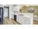 Well-lit kitchen featuring white countertops and cabinets with modern stainless steel sink fixtures at 2114 Turning Leaf Dr, Franklin, IN 46131