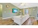 Comfortable living space featuring wood floors, a large television, and a neutral color palette at 2114 Turning Leaf Dr, Franklin, IN 46131