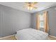 Comfortable bedroom featuring a ceiling fan and a large window offering plenty of natural light at 2210 Bridlewood Dr, Franklin, IN 46131