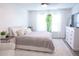 Bright bedroom with large window, neutral colors, and an upholstered headboard at 2210 Bridlewood Dr, Franklin, IN 46131