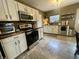 Modern kitchen with stainless steel appliances, updated countertops, white cabinets, and ample natural light at 2210 Bridlewood Dr, Franklin, IN 46131