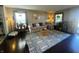 Sunlit living room featuring hardwood floors, a comfortable sofa set, a stylish area rug, and bright windows at 2210 Bridlewood Dr, Franklin, IN 46131