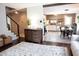 Open concept living room with wood floors and a view into the kitchen and dining area at 2210 Bridlewood Dr, Franklin, IN 46131