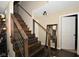 Elegant staircase featuring wooden steps, cable railings, and a modern lighting fixture, creating a stylish entryway at 2210 Bridlewood Dr, Franklin, IN 46131