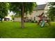 Lush green backyard with play set and patio, ideal for relaxation and entertainment at , Plainfield, IN 46168