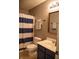 Traditional bathroom featuring a blue and white striped shower curtain, and neutral accents at , Plainfield, IN 46168