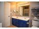 Bright bathroom featuring a double vanity with ample storage, a large mirror, and modern fixtures at , Plainfield, IN 46168