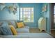 Cozy bedroom with a soft gray sofa, desk, and built-in shelves, perfect for a guest room at , Plainfield, IN 46168