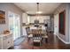 Cozy dining area with modern lighting, hardwood floors, and adjacent kitchen access at , Plainfield, IN 46168
